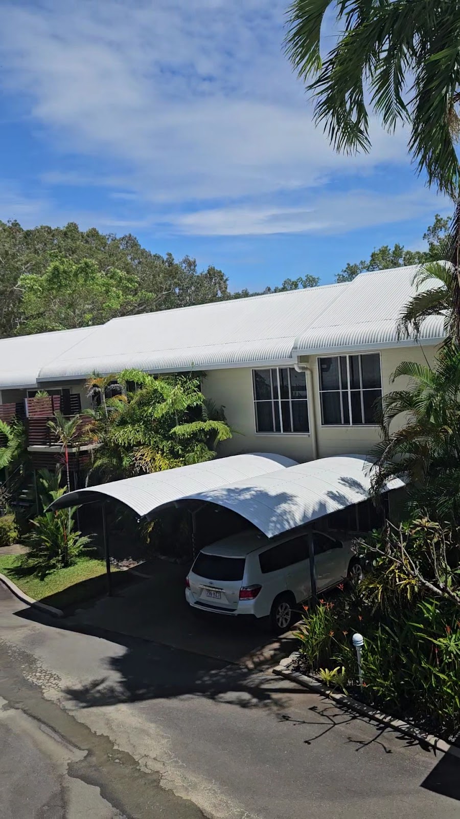 White units and carport with a freshly cleaned driveway in Port Douglas